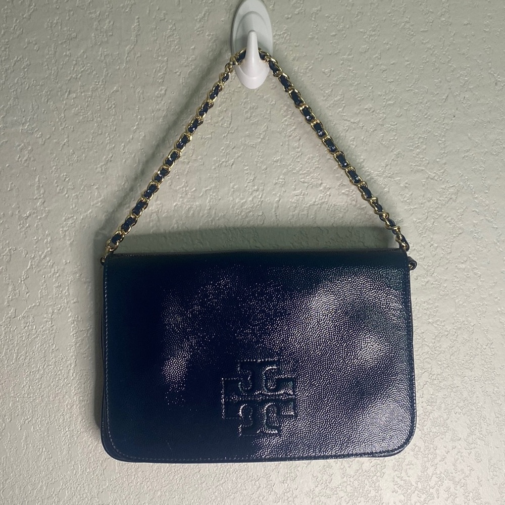 Tory Burch clutch or crossbody bag. Come with long strap.